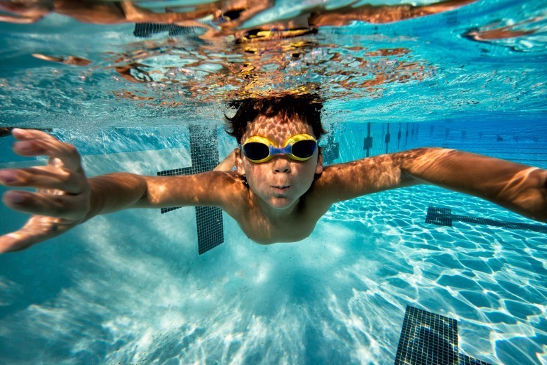 Age group swimming underwater by Mike Lewis